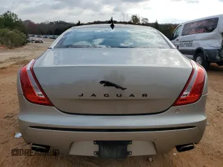 2014 Jaguar XJ with VIN SAJWA1CZ5E8V71971, listed as a Copart auction lot 82116114 with 127,164 mi miles and Salvage Title. Bid and sale history available at DreamBid. Image 6.