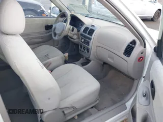 2004 Hyundai Accent GL with VIN KMHCG35C74U303431, listed as a IAAI auction lot 41725717 with 211,893 mi miles. Bid and sale history available at carsss.com. Image 5.