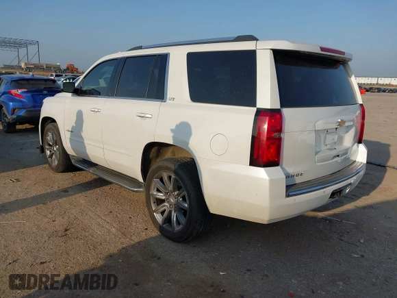 2016 Chevrolet Tahoe LTZ with VIN 1GNSKCKC9GR243895, listed as a IAAI auction lot 42322779 with 162,138 mi miles and . Bid and sale history available at DreamBid. Image 3.