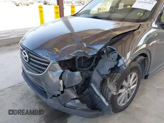 2016 Mazda CX-5 Sport with VIN JM3KE4BY1G0910102, listed as a IAAI auction lot 42115163 with 144,495 mi miles and . Bid and sale history available at carsss.com. Image 6.