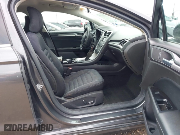 2016 Ford Fusion SE Hybrid with VIN 3FA6P0LU5GR235241, listed as a IAAI auction lot 41697504 with 165,510 mi miles. Bid and sale history available at carsss.com. Image 5.