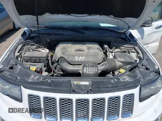 2014 Jeep Grand Cherokee Summit z VIN 1C4RJFJG3EC213145, wystawiony jako IAAI lot #41918145 z przebiegiem 176 460 mil mil oraz . Historia ofert i sprzedaży dostępna na DreamBid. Obrazek 10.