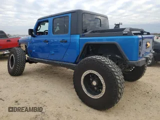 2021 Jeep Gladiator Rubicon with VIN 1C6JJTBM1ML611203, listed as a Copart auction lot 87203924 with 27,645 mi miles and Salvage title. Bid and sale history available at DreamBid. Image 2.