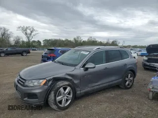 2012 Volkswagen Touareg Sport z VIN WVGFK9BPXCD001619, wystawiony jako Copart lot #55078535 z przebiegiem 168 248 mil mil oraz Szkoda całkowita • Salvage title. Historia ofert i sprzedaży dostępna na DreamBid. Obrazek 1.