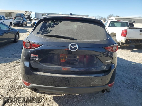 2018 Mazda CX-5 Grand Touring with VIN JM3KFADM4J1341740, listed as a Copart auction lot 46805955 with 99,114 mi miles and Salvage Title. Bid and sale history available at DreamBid. Image 6.
