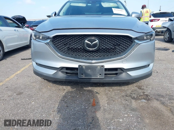 2020 Mazda CX-5 Grand Touring with VIN JM3KFADM5L0739306, listed as a IAAI auction lot 42215667 with 126,100 mi miles and . Bid and sale history available at DreamBid. Image 12.
