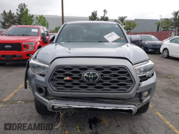 2021 Toyota Tacoma SR z VIN 3TMCZ5AN3MM374132, wystawiony jako IAAI lot #42068562 z przebiegiem 38 654 mil mil oraz . Historia ofert i sprzedaży dostępna na DreamBid. Obrazek 6.