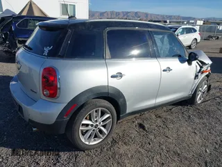 2012 MINI Countryman with VIN WMWZB3C59CWM05749, listed as a IAAI auction lot 38329304 with 64,590 mi miles and . Bid and sale history available at DreamBid. Image 4.