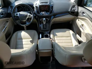 2015 Ford Escape Titanium with VIN 1FMCU0J93FUA58325, listed as a Copart auction lot 64135685 with 126,356 mi miles and Salvage title. Bid and sale history available at DreamBid. Image 8.