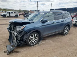 2017 Honda Pilot Touring z VIN 5FNYF6H99HB079995, wystawiony jako Copart lot #54416855 z przebiegiem 75 683 mil mil oraz Szkoda całkowita • Salvage title. Historia ofert i sprzedaży dostępna na DreamBid. Obrazek 1.