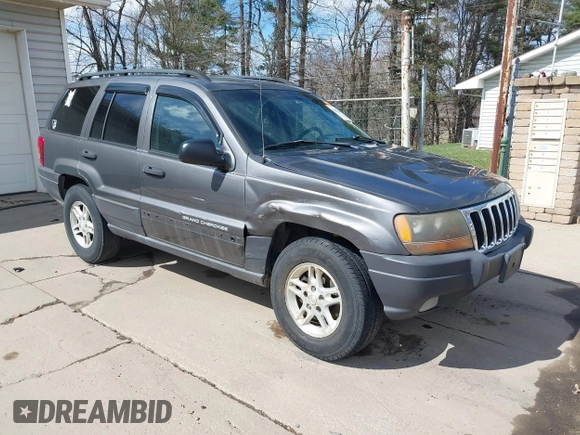 2003 Jeep Grand Cherokee Laredo with VIN 1J4GX48S53C504225, listed as a IAAI auction lot 41879669 with 247,246 mi miles. Bid and sale history available at carsss.com. Image 1.