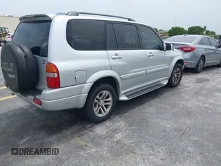 2003 Suzuki XL7 Touring z VIN JS3TX92V434114930, wystawiony jako IAAI lot #42414005 z przebiegiem 148 945 mil mil oraz . Historia ofert i sprzedaży dostępna na DreamBid. Obrazek 4.