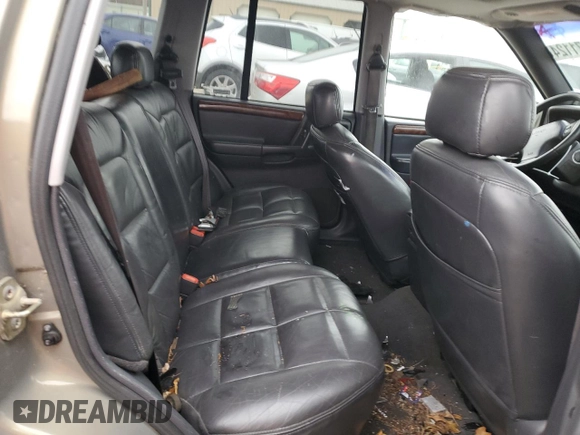 1997 Jeep Grand Cherokee Limited with VIN 1J4GZ78Y3VC568413, listed as a Copart auction lot 86171124 with 104,558 mi miles and Salvage Title. Bid and sale history available at carsss.com. Image 10.