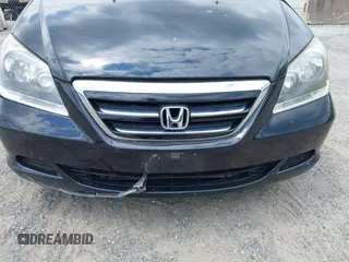 2005 Honda Odyssey EX-L with VIN 5FNRL38775B085512, listed as a IAAI auction lot 42128261 with Not Provided miles and . Bid and sale history available at DreamBid. Image 6.