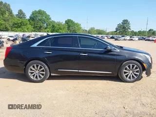 2013 Cadillac XTS Premium z VIN 2G61S5S34D9127996, wystawiony jako IAAI lot #41978539 z przebiegiem 185 157 mil mil oraz . Historia ofert i sprzedaży dostępna na DreamBid. Obrazek 13.