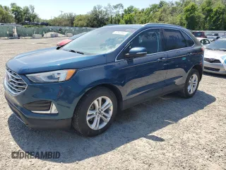 2020 Ford Edge SEL z VIN 2FMPK3J9XLBA59093, wystawiony jako Copart lot #52542645 z przebiegiem 128 059 mil mil oraz Czysty tytuł • Clean title. Historia ofert i sprzedaży dostępna na DreamBid. Obrazek 1.