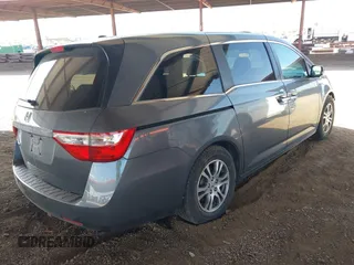 2012 Honda Odyssey EX-L with VIN 5FNRL5H6XCB103498, listed as a IAAI auction lot 42065658 with 104,933 mi miles and . Bid and sale history available at carsss.com. Image 4.