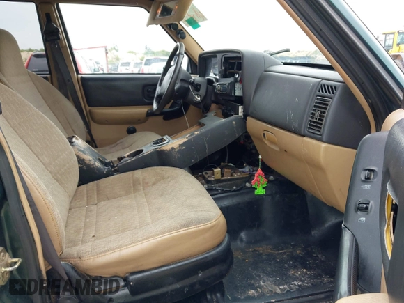 1999 Jeep Cherokee Sport z VIN 1J4FT68S1XL667138, wystawiony jako IAAI lot #42651020 z przebiegiem 200 324 mil mil oraz . Historia ofert i sprzedaży dostępna na DreamBid. Obrazek 5.