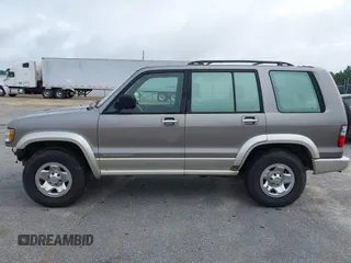 2002 Isuzu Trooper S with VIN JACDJ58X527J07745, listed as a IAAI auction lot 42714673 with 122,482 mi miles and . Bid and sale history available at DreamBid. Image 14.