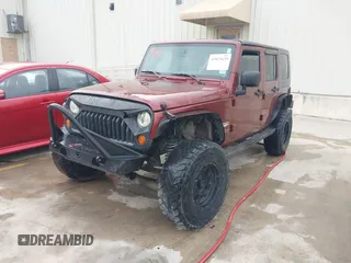 2007 Jeep Wrangler Unlimited Sahara with VIN 1J4GB59197L142223, listed as a IAAI auction lot 42025639 with 155,274 mi miles and . Bid and sale history available at DreamBid. Image 2.
