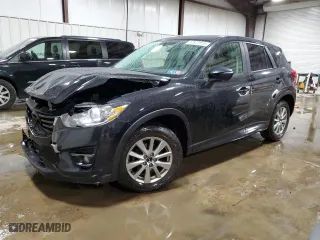 2016 Mazda CX-5 Touring with VIN JM3KE4CY0G0899611, listed as a Copart auction lot 52872915 with 76,801 mi miles and Salvage Title. Bid and sale history available at carsss.com. Image 1.