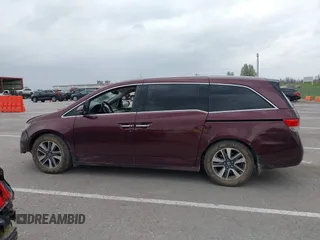 2014 Honda Odyssey Touring with VIN 5FNRL5H94EB127695, listed as a IAAI auction lot 41936109 with 221,786 mi miles and . Bid and sale history available at DreamBid. Image 14.