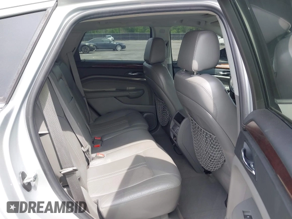 2011 Cadillac SRX Luxury Collection with VIN 3GYFNAEY5BS563048, listed as a IAAI auction lot 42031973 with 182,047 mi miles and . Bid and sale history available at DreamBid. Image 8.