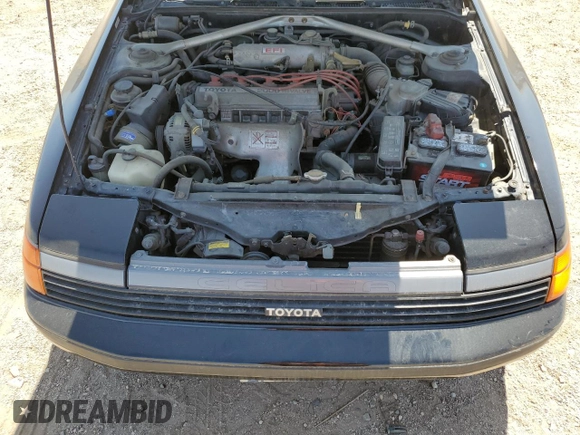 1989 Toyota Celica z VIN JT2ST67C8K7337876, wystawiony jako Copart lot #57918785 z przebiegiem 16 862 mil mil oraz Tytuł czysty. Historia ofert i sprzedaży dostępna na DreamBid. Obrazek 11.