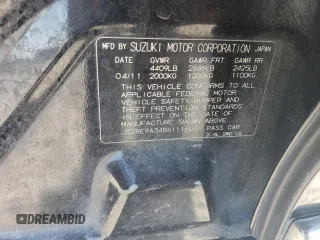 2011 Suzuki Kizashi SE z VIN JS2RE9A34B6111601, wystawiony jako Copart lot #75945784 z przebiegiem 128 926 mil mil oraz Szkoda całkowita • Salvage title. Historia ofert i sprzedaży dostępna na DreamBid. Obrazek 12.
