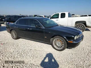 2006 Jaguar XJ with VIN SAJWA79B66SH07528, listed as a Copart auction lot 80396994 with 114,922 mi miles and Clean Title. Bid and sale history available at carsss.com. Image 4.