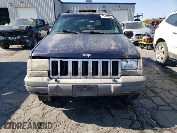 1998 Jeep Grand Cherokee Laredo with VIN 1J4GZ58S8WC167716, listed as a Copart auction lot 76477694 with 167,519 mi miles and Salvage Title. Bid and sale history available at carsss.com. Image 5.