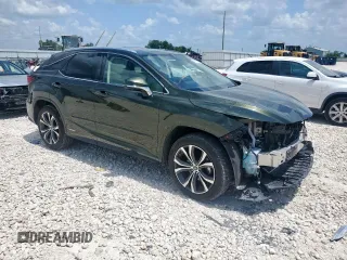 2020 Lexus RX 450h with VIN 2T2HGMDA3LC046646, listed as a Copart auction lot 61030015 with 74,709 mi miles and Salvage title. Bid and sale history available at DreamBid. Image 4.