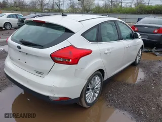 2015 Ford Focus Titanium with VIN 1FADP3N23FL293432, listed as a IAAI auction lot 41929774 with 100,865 mi miles. Bid and sale history available at carsss.com. Image 4.