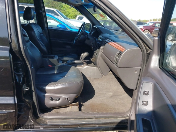 1999 Jeep Grand Cherokee Laredo with VIN 1J4GW58S5XC687480, listed as a IAAI auction lot 42016415 with 186,776 mi miles. Bid and sale history available at carsss.com. Image 5.