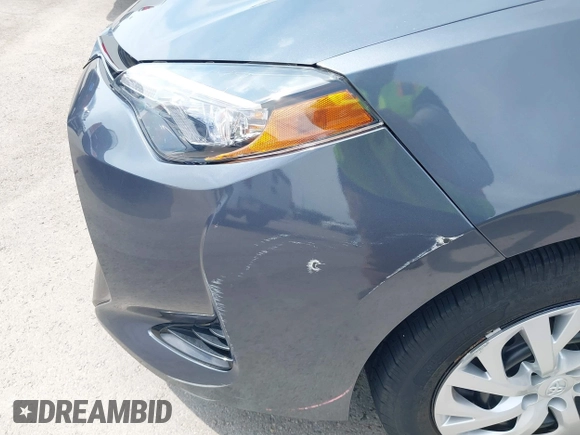 2018 Toyota Corolla L with VIN 5YFBURHE8JP770696, listed as a IAAI auction lot 42386025 with 63,224 mi miles and . Bid and sale history available at DreamBid. Image 18.