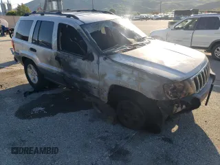 2003 Jeep Grand Cherokee Laredo with VIN 1J4GX48S63C523513, listed as a Copart auction lot 50001005 with 0 mi miles and Salvage Title. Bid and sale history available at carsss.com. Image 4.