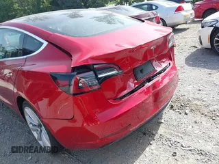 2020 Tesla Model 3 Standard Range Plus with VIN 5YJ3E1EA9LF708808, listed as a IAAI auction lot 40018323 with 32,069 mi miles. Bid and sale history available at carsss.com. Image 6.