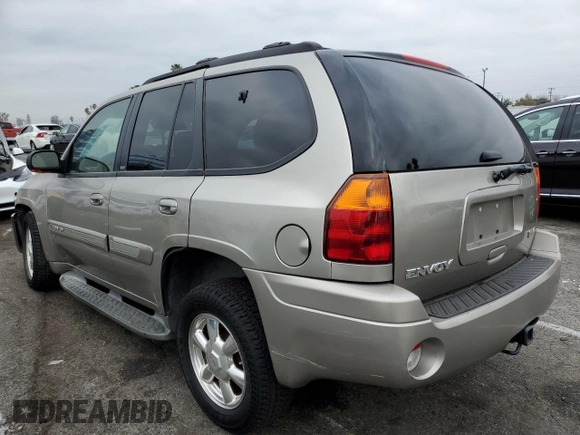2003 GMC Envoy SLE with VIN 1GKDS13S232236886, listed as a Copart auction lot 43220545 with 58,229 mi miles and Salvage Title. Bid and sale history available at carsss.com. Image 2.