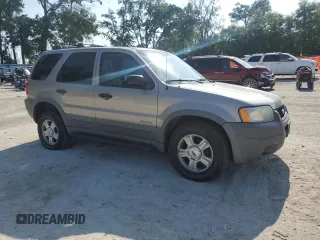 2001 Ford Escape XLT с VIN 1FMCU04131KC39323, выставлен на аукционе Copart как лот 57726825 с пробегом 170 104 миль миль и Списание • Salvage title. История ставок и продаж доступна на DreamBid. Изображение 4.