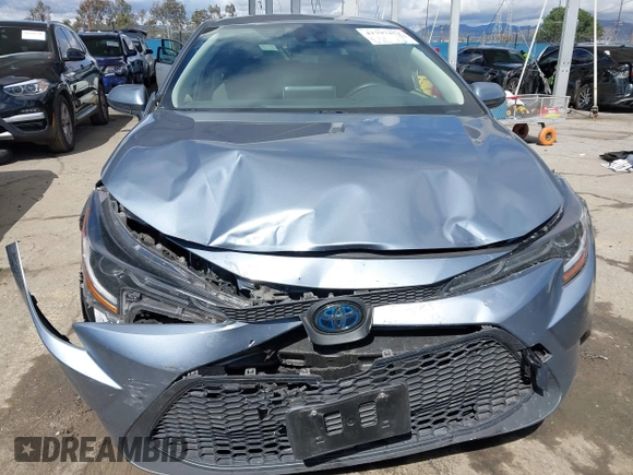 2021 Toyota Corolla Hybrid LE with VIN JTDEAMDE0MJ026601, listed as a IAAI auction lot 41797452 with 85,294 mi miles. Bid and sale history available at carsss.com. Image 12.