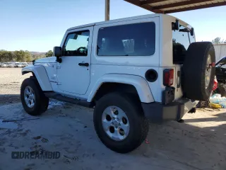 2014 Jeep Wrangler Sahara with VIN 1C4AJWBG1EL168007, listed as a Copart auction lot 87331394 with 113,228 mi miles and Salvage Title. Bid and sale history available at DreamBid. Image 2.