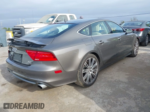 2012 Audi A7 Prestige с VIN WAU2GAFC7CN122113, выставлен на аукционе IAAI как лот 42111441 с пробегом 149 617 миль миль и . История ставок и продаж доступна на DreamBid. Изображение 4.
