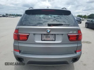 2012 BMW X5 35i with VIN 5UXZV4C59CL991689, listed as a Copart auction lot 64022615 with 208,620 mi miles and Salvage title. Bid and sale history available at DreamBid. Image 6.