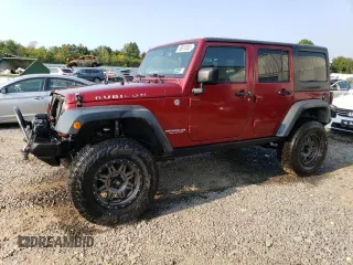 2013 Jeep Wrangler Unlimited Rubicon 10th Anniversary with VIN 1C4HJWFG2DL572943, listed as a Copart auction lot 80610363 with 88,296 mi miles and Salvage title. Bid and sale history available at DreamBid. Image 1.