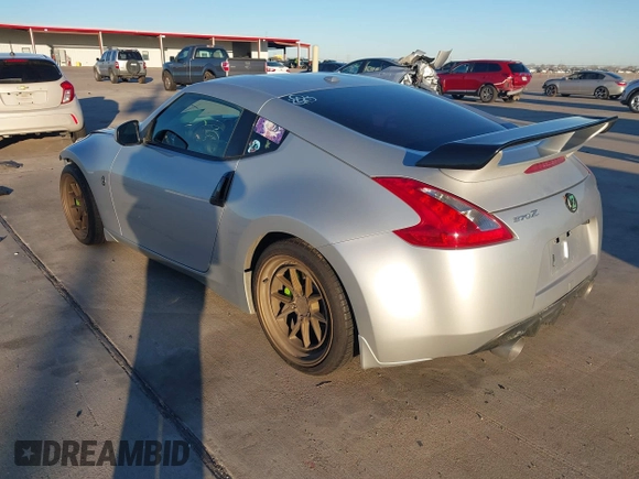 2014 Nissan 370Z Nismo with VIN JN1AZ4EH4EM634236, listed as a IAAI auction lot 41256664 with 80,294 mi miles and . Bid and sale history available at DreamBid. Image 3.