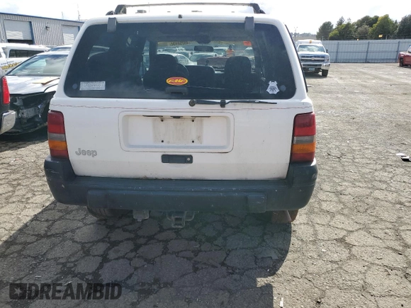 1997 Jeep Grand Cherokee Laredo with VIN 1J4GZ58S8VC647415, listed as a Copart auction lot 49258934 with 0 mi miles and Salvage Title. Bid and sale history available at carsss.com. Image 6.
