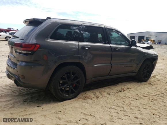 2015 Jeep Grand Cherokee SRT with VIN 1C4RJFDJ9FC842448, listed as a Copart auction lot 56956284 with 178,141 mi miles and Salvage Title. Bid and sale history available at carsss.com. Image 3.
