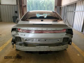 2015 Lincoln MKZ Hybrid z VIN 3LN6L2LU1FR606066, wystawiony jako Copart lot #61955415 z przebiegiem 127 214 mil mil oraz Szkoda całkowita • Salvage title. Historia ofert i sprzedaży dostępna na DreamBid. Obrazek 6.