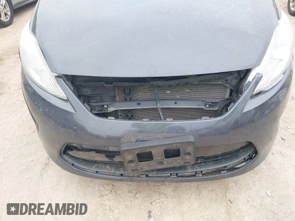2013 Ford Fiesta S z VIN 3FADP4AJ9DM175576, wystawiony jako IAAI lot #42449969 z przebiegiem 123 959 mil mil oraz . Historia ofert i sprzedaży dostępna na DreamBid. Obrazek 6.