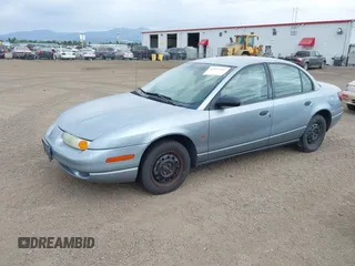 2002 Saturn SL z VIN 1G8ZS52842Z289815, wystawiony jako IAAI lot #42557607 z przebiegiem 184 671 mil mil oraz . Historia ofert i sprzedaży dostępna na DreamBid. Obrazek 2.